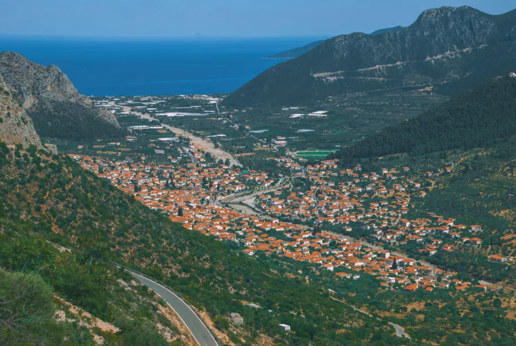Leonidio beneath cinnamon cliffs